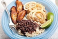 A classic Cuban dinner of roast pork, black beans and rice, and fried sweet plantains