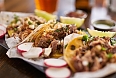 Three authentic Mexican street tacos with barbacoa, carnitas and chicken
